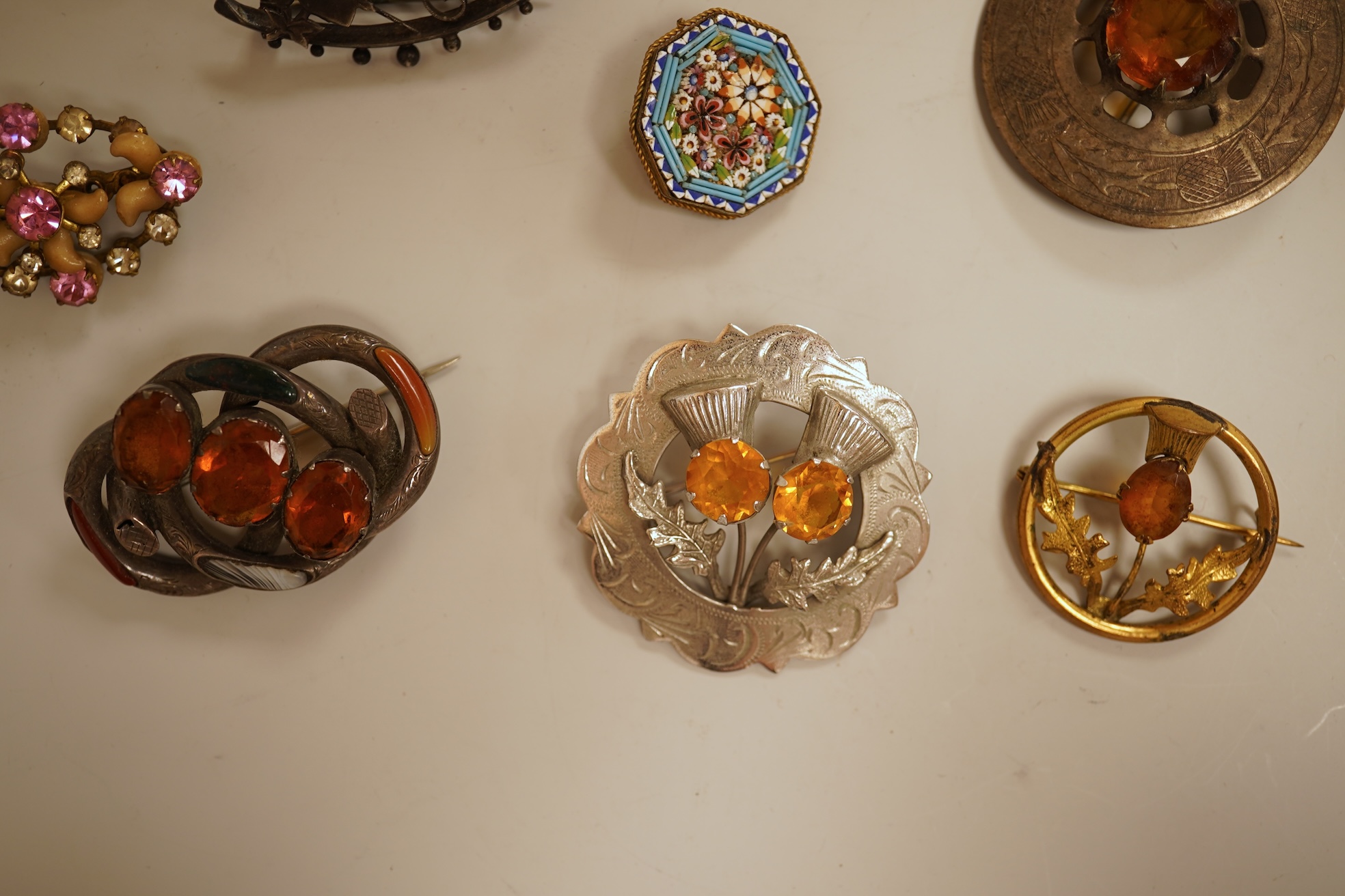 A small group of assorted jewellery including a gold plated curb link bracelet, silver brooch, simulated pearl necklace and costume.